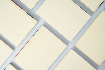 Top view of a formation of books forming a diagonal grid,