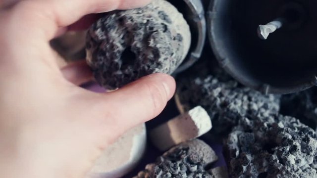 Multi-layer gas silicate and expanded clay concrete medal with a hole in the center (drill sample, centre mark, stippler, borehole sample, kern) - construction debris after the manufacture of junction