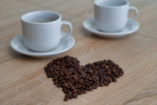 Coffee beans and two cups of coffee,picture of coffee beans for coffee lovers
