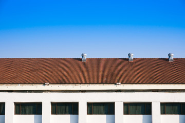 Air Ventilators on the roof top spinning and take cool air into the building