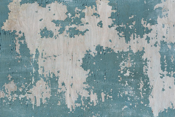 Cracked turquoise paint on old wood. background for lettering text