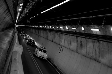 Underground tunnel for cars black and white photo.