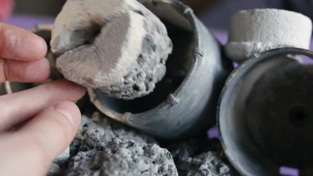 the hand puts the core in the crown for drilling hard rocks of stone, concrete,gas silicate, expanded clay. Close-up, real time, contains people