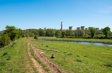Country landscape with distant power station