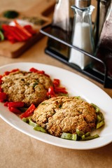 Authentic Mediterranean dish photography presentable greek food plating with green and red capsicum on a wooden casual dine in table background.