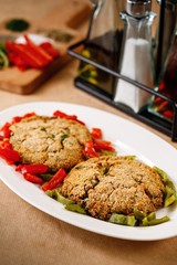 Red sauce with dried tomatoes and herbs. Authentic Mediterranean dish on presentable plating in wooden background.