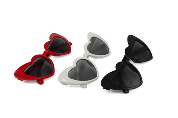 Colorful sunglasses with folded view. Collection of heart shape sunglasses isolated on white background. Red, White and Black Colors. Side view.