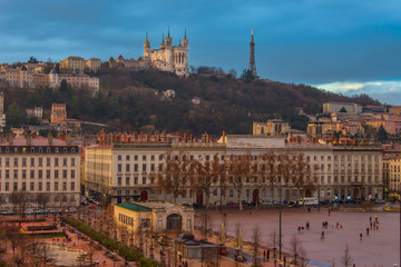 Fototapeta premium Basilique Notre Dame de Fourviere Church seen from the Place Bellecour square. These two places are major landmarks of Lyon