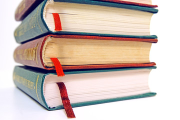 Book stack on a white background with bookmarks on classic, vintage style