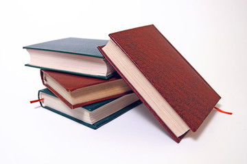 Book stack on a white background with bookmarks on classic, vintage style