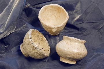 Kiev, Ukraine. January 10 2020.  Modern pottery. Decorative ceramic, clay plate. Handmade light pottery.  Set of ceramic, bowls, cup with background.