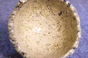 Kiev, Ukraine. January 10 2020.  Modern pottery. Decorative ceramic, clay plate. Handmade light pottery.  Set of ceramic, bowls, cup with background.