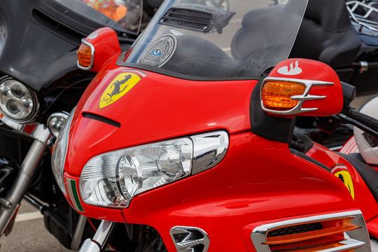 Moscow, Russia - May 04, 2019: Headlights in bright red windproof shield of tourist trike Honda Gold Wing closeup