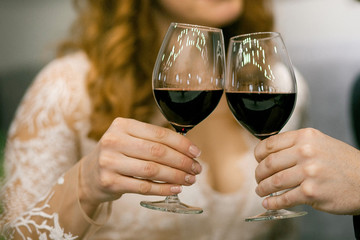 
couple drinks wine from glass goblets. Wedding