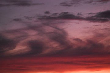 Naklejka na ściany i meble Summer sunset with pink-orange sky with clouds.