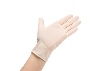 Woman puts on white rubber gloves.