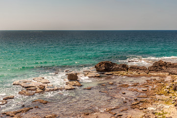  landscape of rocky seashore on a twilight day
