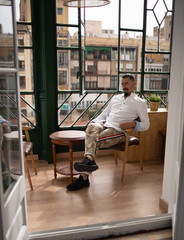 a young stylish man in an apartment in self-isolation