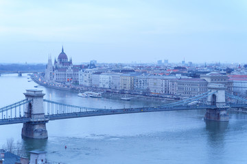 Fototapeta na wymiar Evening view upon Budapest. The Chain Bridge, Palace of Parliament and Danube river are just the perfect trio