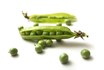 Closeup of fresh organic peas on white background