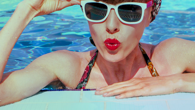 Stylish Portrait Of Pretty Young Woman Posing In The Swimming Pool.  Swimsuit, Sunglasses, Retro Look, Outdoor Fashion Portrait Elegant Woman Relaxing