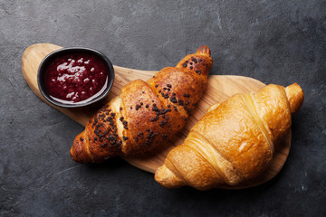 Fresh croissants with berry jam