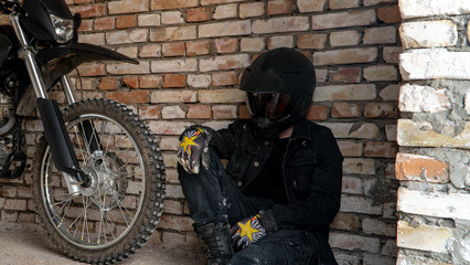 Fototapeta na wymiar cross-country motorcycle driver in a helmet