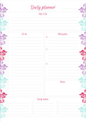 White daily planner with bright leaves design.