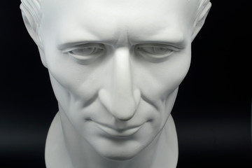  julius caesar roman emperor gypsum bust on black background