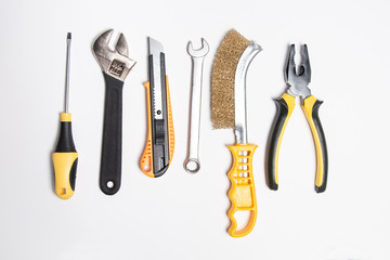 Set of kit manual steel tool - Pliers, screwdriver, adjustable wrench, brush, knife and spanner.