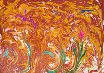 Orange abstraction made by ebru paints. Liquid abstract artwork