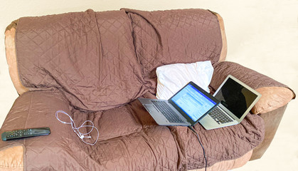 Work from home couch with laptops