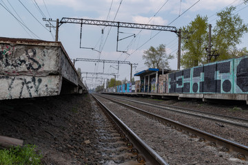 Fototapeta na wymiar rail road with graffiti and concrete walls