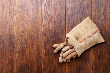 Sweet tamarind  in a wooden bowl on a wooden table top view.