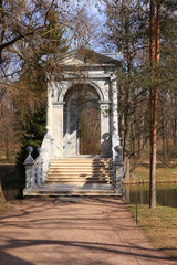 Fototapeta na wymiar Russia, St. Petersburg, April 19, 2020, Marble Bridge in Catherine Park in the city of Pushkin in early spring during quarantine due to the epidemic of coronavirus. The park is without people