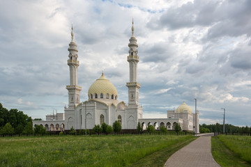 Fototapeta na wymiar Beautiful white mosque in the city of Bolgar on the background of a beautiful blue sky