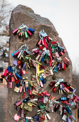 Love locks hanging on a rock