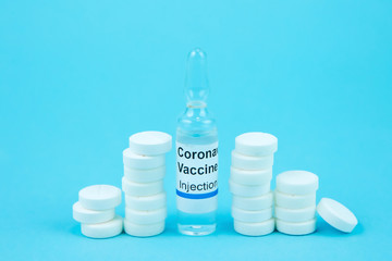coronavirus vaccine testing. Vials with medicines, pills, syringes, thermometer, medical mask on a...