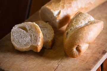 sliced italian bread on wooden board