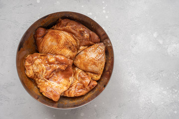 Raw piece of marinated chicken with spice and sauce prepered for barbecue