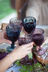 
wine in glass glasses that are held in hands