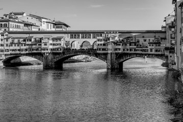 Fototapeta na wymiar A black and white of Ponte Vecchio in Florence, Italy. In a sunny day with no clouds.