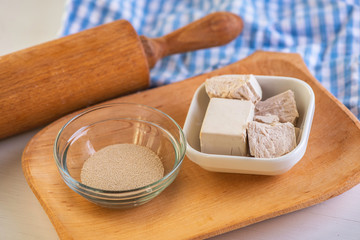 ingredients for baking Dry yeast crumbled and yeast block for baking.