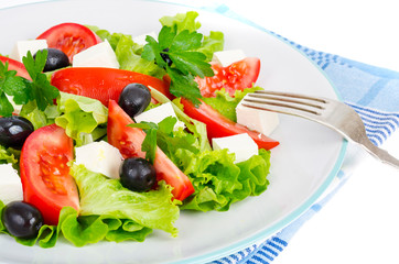 Healthy lifestyle. Vegetable diet salad with olives and goat cheese on white background.