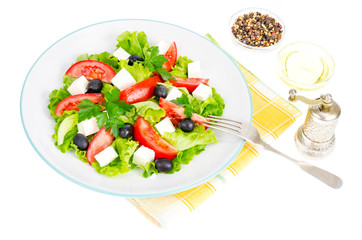 Healthy lifestyle. Vegetable diet salad with olives and goat cheese on white background.