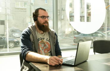 Online lesson. A young man conducts an online lesson during quarantine. Pandemic.