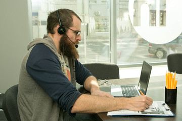 Online lesson. A young man conducts an online lesson during quarantine. Pandemic.