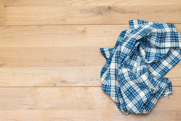 napkin tablecloth above wooden background