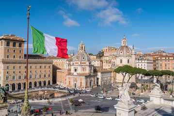 Panorama of Piazza Venezia seen from above with Italian flags