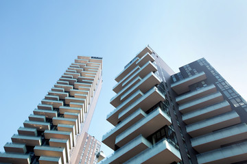 Huge balconies on a modern building against the blue sky. 01.2020 Milan